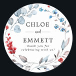 Sticker Rond Rustic Red Floral et Pastel Blue Mariage Merci<br><div class="desc">Une belle et rustique couronne prépare le terrain pour votre message de remerciement. De petits bourgeons de fleurs rouges et de minuscules fleurs turquoise se mêlent aux feuilles et aux vignes bleu acier. Ouvert, aéré et très moderne. Les noms des couples mariages sont au centre dans une simple police serif....</div>