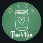 Sticker Rond Rustique Mason Jar Merci Green Chalkboard<br><div class="desc">Faites plaisir à vos amis et à votre famille avec ces stickers charmants en Merci en bocal. Cet autocollant rustique présente un pot en maçon blanc dessiné à la main avec des coeurs blancs et un message de remerciement imprimé dans une police en caractères gras surligné contre un arrière -...</div>