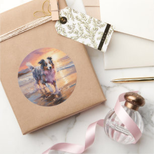 Sticker Rond Sandy Australian Shepherd Dog on Beach Sunset