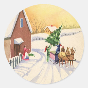 Sticker Rond Sapin de Noël vintage sur une route enneigée d'hiv
