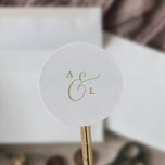 Sticker Rond Sceau Mariage d'enveloppe Elegant Gold Script Mono<br><div class="desc">Ces élégants sceaux d'enveloppe de mariage en or monogramme sont parfaits pour un mariage simple. Le design minimaliste or et blanc présente une typographie romantique avec style glamour moderne. Personnalisable dans n'importe quelle couleur. Gardez le design minimal et élégant, tel quel, ou personnalisez-le en ajoutant vos propres graphiques et artwork....</div>
