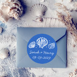 Sticker Rond Seashells Beach Wedding Blue White CUSTOM<br><div class="desc">Perfect cute sticker for a fun wedding or engagement! Hand made art for you! Perfect for a wedding, seaside bridal shower, bachelorette party, engagement party, anniversary or even special birthday. FULLY CUSTOMIZABLE! Click on “Personalize” above to edit the text.. Click "edit using design tool" to adjust the fonts, colors and...</div>