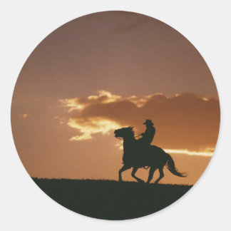 Sticker Rond Silhouette Galloping Cowboy