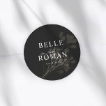 Sticker Rond Simple Black & White Botanical Wedding<br><div class="desc">An elegant round wedding sticker featuring a sophisticated black background with soft botanical greenery. The design highlights the couple’s names and wedding date in timeless typography, creating a modern and romantic finishing touch. Perfect for sealing envelopes, decorating wedding favors, invitation suites, or adding a stylish detail to your wedding stationery....</div>