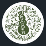 Sticker Rond Snowman Christmas Winter Wonderland typographie<br><div class="desc">Une composition de typographie festive de la citation de Noël manuscrite (Snow Chill, Jingle Bells, Cold Winter, White Christmas, Wonderland, Christmas Wish) encercle un doodle bonhomme de neige avec peu de coeurs et des flocons de neige. Parfait pour vous sceller les lettres et les Cartes de fin de année de...</div>