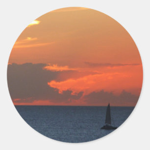 Sticker Rond Sunset Clouds and Sailboat Seascape