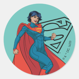 Sticker Rond Supergirl Hovering en costume bleu