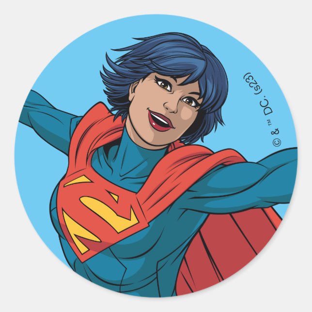 Sticker Rond Supergirl volant en costume bleu (Devant)