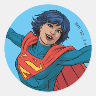 Sticker Rond Supergirl volant en costume bleu
