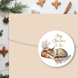 Sticker Rond Sweet Kitten dormant sur une couverture chaude Noë