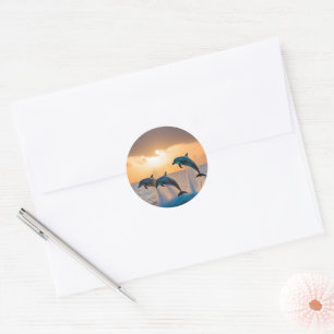 Sticker Rond Trois Dauphins Tournant Au Coucher Du Soleil,