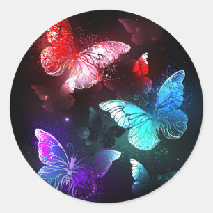 Sticker Rond Trois papillons lumineux sur fond de nuit
