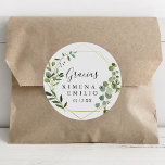 Sticker Rond Tropical Green Espagnol Merci mariage Faveur<br><div class="desc">Ce sticker vert tropical espagnol merci mariage faveur classique rond est parfait pour un mariage moderne. Le design présente de beaux feuilles verts peints à la main, ornant un cadre géométrique doré. Faites de l'autocollant votre propre étiquette en incluant vos noms, l'événement (s'il y a lieu) et la date. Ces...</div>