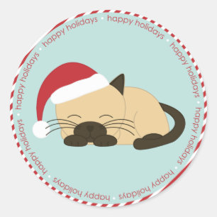 Sticker Rond Un chat qui fait la sieste porte un chapeau de Pè
