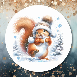 Sticker Rond Un écureuil mignon à Noël de neige