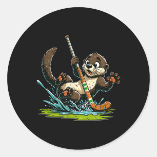Sticker Rond Une loutre mignonne jouant au hockey en éclaboussa