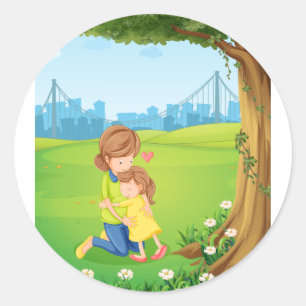 Sticker Rond Une mère embrasse sa fille sous l'arbre