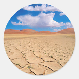 Sticker Rond Une plaine désertique fissurée