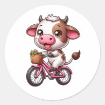 Vache marron et blanche à vélo