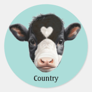 Sticker Rond Vache noire et blanche de campagne sur fond bleu c