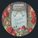 Sticker Rond Vintage Blue Mason Jar Rustic Floral Fête des mari<br><div class="desc">Un ancien bocal de mason bleu et un bouquet botanique de roses rouges et coralliens sur un arrière - plan rustique en faux bois confèrent à cette Fête des mariées un style champêtre moderne. Design par Holiday Hearts Designs incorporant l'imagerie vintage (droits réservés).</div>