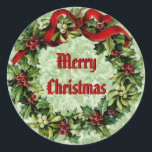 Sticker Rond Vintage Christmas Holly Wreath avec Red Ribbon V09<br><div class="desc">Cette Serre de Noël Vintage Holly avec Ruban Rouge fait un doux ajout à vos cartes de fin de année et cadeaux de Noël.</div>