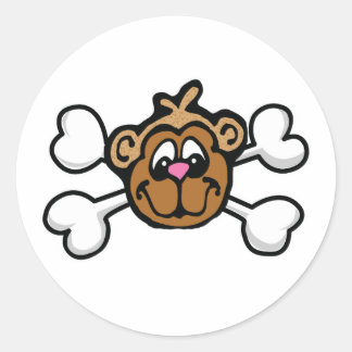 Sticker Rond visage de singe Crâne et os croisés