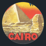Sticker Rond Voyage vintage au Caire en Egypte<br><div class="desc">Cairo Egypt Hotel Africa Vintage voyage Art Vintage illustrations colorées nostalgiques d'hôtels anciens et élégants et de complexes de luxe du monde entier. Notre collection d'oeuvres d'art visite les destinations touristiques de l'ancienne affiches de voyage et les étiquettes de bagages présentent des paysages luxuriants, des villes en plein essor et...</div>
