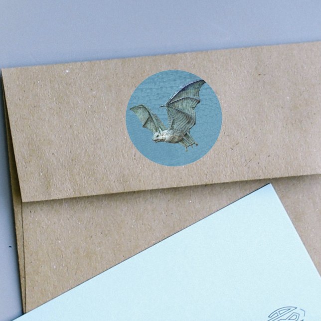 Stickers d'aide à la chauve-souris bleu volant (Flying blue bat spooky white face on blue round stickers.)