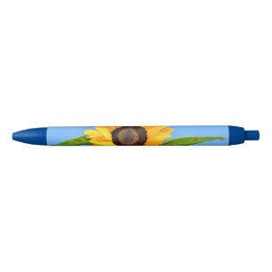Stylo Bleu Tournesol jaune contre soleil sur ciel bleu - ét