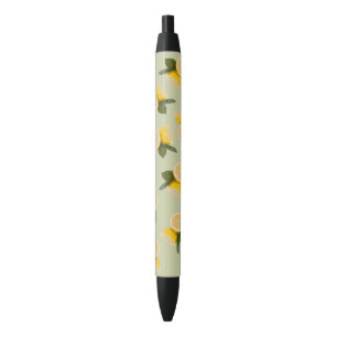 Stylo Noir Fruit jaune de citron d'agrume sur le vert de
