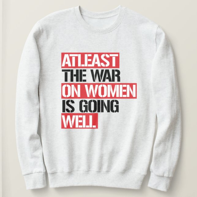 Sweatshirt Au moins, la guerre contre les femmes se porte bie (Design devant)