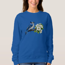 Geai bleu avec des fleurs blanches