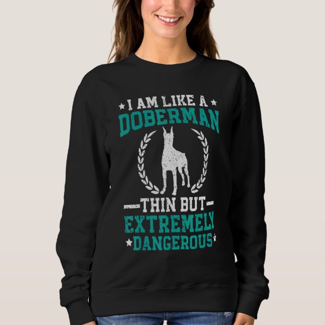 Sweatshirt Je suis comme un dobermann mince mais extrêmement  (Devant)