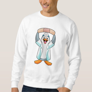 Sweatshirt Pingouin comme docteur avec plâtre