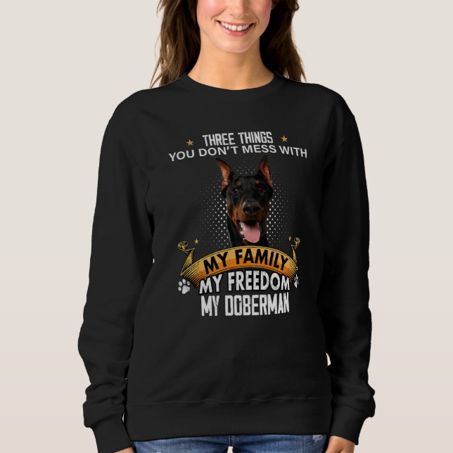 Sweatshirt Trois choses que vous ne manquez pas avec Doberman (Devant)