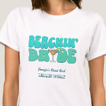 T-shirt Beach Bachelorette Party Super Beachin Bride<br><div class="desc">Faites un peu de plaisir à votre prochaine soirée de bachelorette avec ce magnifique jeu de maillots de plage personnalisés. Que vous fêtiez un voyage à la plage, des vacances pour les filles ou des vacances pour les meilleurs amis, ces t-shirts personnalisés pour les fêtes de bachelorette de plage sont...</div>