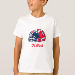 T-shirt Casque de balle de football Caricature Birthday Bo<br><div class="desc">T-shirt Nom du jeu de casque de balle de football. T-shirt d'anniversaire de football moderne et amusant avec un nom personnalisé. Avec une illustration audacieuse d'un ballon de football et d'un casque dans les tons rouge et bleu. Ajoutez votre nom.</div>