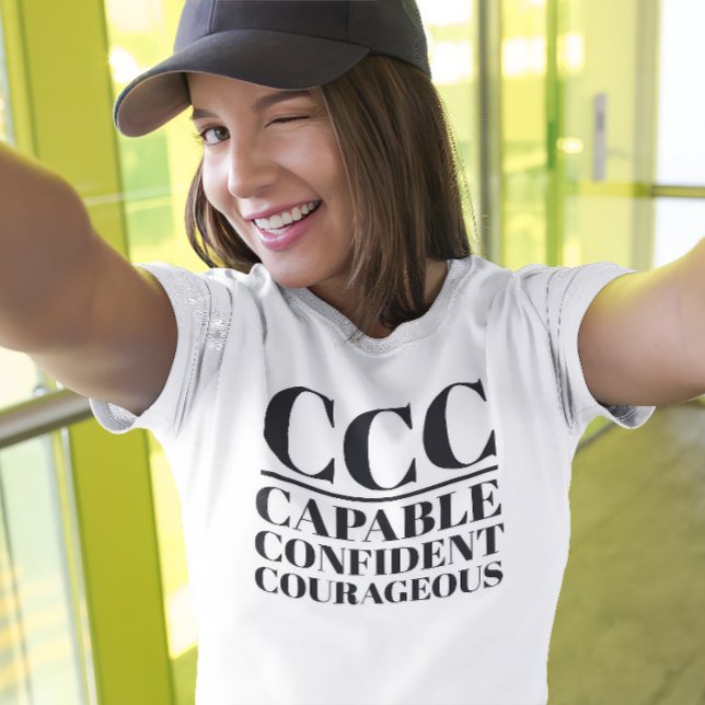 T-shirt CCC - Capable, confiant, courageux (Young woman wears a "CCC:Capable, Confident, Courageous" white t-shirt.)
