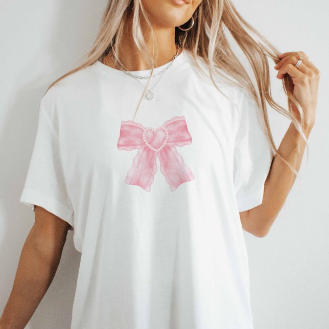 T-shirt coquette rose (Pink bow on white oversized tee.)