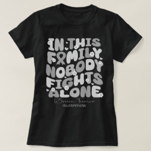 T-shirt Dans Cette Famille, Personne ne combat seul la tum