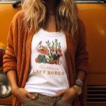 T-shirt Dernier Rodéo<br><div class="desc">Dernier T-shirt Rodeo. Allons-y, les filles ! Préparez-vous à une balade sauvage dans le Far West ! Ce t-shirt est amusant et parfait pour un week-end de bachelorette ou une douche à thème occidental. Unique et original, avec des cactus dessinés à la main et aquarellés, des bottes de cowboy et...</div>