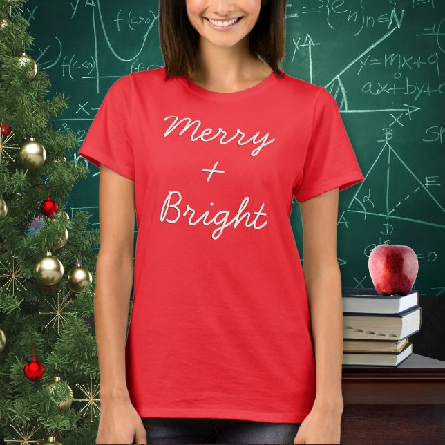 T-shirt Drôle Signe Plus Thème Mathématiques Joyeux Noël L (A festive t-shirt with 'Merry + Bright' in a script font. The plus sign adds a mathematical touch)