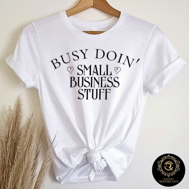T-shirt En Tri-matière Business Casual Graphic Tee Doin' Business Stuff  (White t-shirt on hanger with quote "Busy Doin' Small Business Stuff")