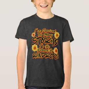 T-SHIRT  EN TRI-MATIÈRE J'AI SURVÉCU À TROP DE TEMPÊTES POUR ÊTRE DÉRANGÉ 