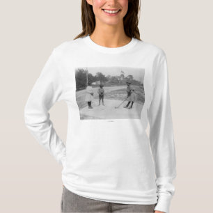 T-shirt Enfants noirs jouant la photographie de golf