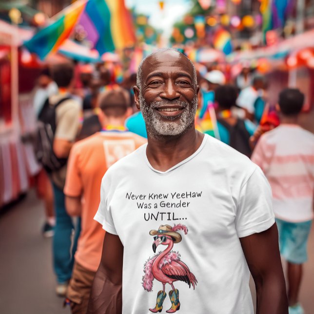 T-shirt Funny Flamingo Rodeo Drag Queen LGBTQ (Flamboyant flamingo LGBTQ pride shirt on Black Gen X  male model. Western drag look boa and boots.)