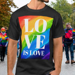 T-shirt L'amour est l'amour Rainbow Pride<br><div class="desc">Ce T-shirt Pride est décoré avec LOVE IS LOVE en caractères blancs gras sur un arc-en-ciel d'aquarelle arrière - plan de rouge,  orange,  jaune,  vert,  bleu et violet. Aquarelle originale © Michele Davies.</div>