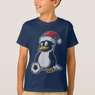 T-shirt Le football de pingouin de Noël
