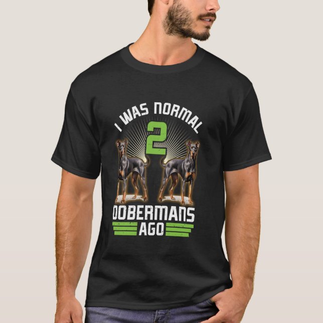 T-shirt Le propriétaire de Doberman ÉTAIT NORMAL AVANT 2 D (Devant)
